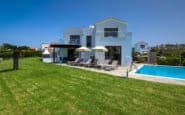 Luxury white villa for hire Cyprus with pool and patio in upscale neighbourhood.