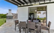 Enjoy your Paphos Holiday at this Villa with Cozy outdoor patio with wicker furniture, barbecue grill, and ocean view.