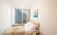 Cozy and modern bedroom with minimalist design and bright color palette in holiday rentals in Cyprus Protaras