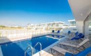 Luxurious modern swimming pool area at holiday rentals in Cyprus Protaras