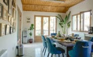 Dining area at Villa Aura in Nicosia with natural light and wooden ceiling