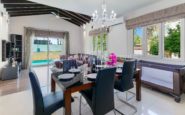 Sophisticated modern living and dining area with family-friendly touches and elegant decor.