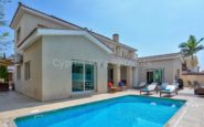 Modern luxury villa with swimming pool and outdoor patio in Kato Paphos, ideal for relaxation.