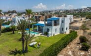 View of Daphne from the front . Neighbouring mountains can be seen on the side. Detatched Villas in Cyprus Paphos