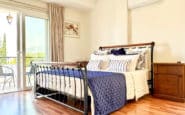 Cozy bedroom with balcony at Villa Palms View in Limassol