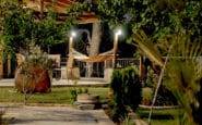 Garden view patio at Villa Aura in Nicosia with hammock and seating