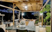 Outdoor kitchen area at Villa Aura in Nicosia with barbecue grill and hammock