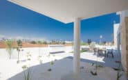 Villas in Cyprus Protaras Modern outdoor patio with minimalist design, dining area, and garden oasis