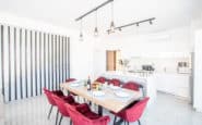 Modern, stylish dining and kitchen area in a bright villa in Protaras, Cyprus.