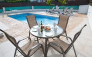 Relaxing poolside dining area at a villa rental in Protaras, Cyprus.