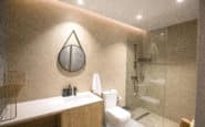 Modern Cyprus Villas Rentals with minimalist bathroom design with sleek vanity, glass shower, and geometric mirror.