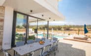 Cyprus Villas Rentals with outdoor dining area and pool in a secluded Cyprus villa rental.