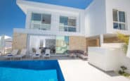 Luxurious modern two-story villa with pool and outdoor seating with Cyprus Protaras Villa Rentals.