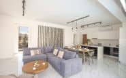 Modern open-plan living and dining area in stylish Cyprus Protaras Villa Rentals.