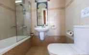 Modern and elegant bathroom with beige mosaic tiles in Villa Elyse, Protaras.