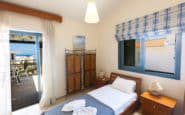 Cozy bedroom with balcony view in a lovely holiday villa in Protaras.