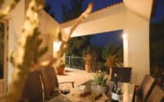 Evening patio at Villa Aura in Nicosia with outdoor seating and potted plants