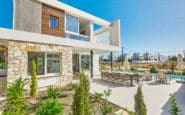 Modern two-story Villa with garden, pool, dining area, and sunbeds in Cyprus Ayia Napa