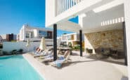 Ayia Napa Villas with poolside oasis with outdoor dining and garden furniture.