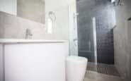 Modern and sleek bathroom with glass shower enclosure in Cyprus villa rental in Protaras Cyprus