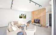 Modern Ayia Napa Villa, airy living room with sleek decor, plush seating, and natural light.