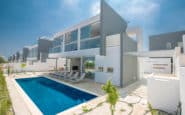 Modern luxury villa with pool, sun loungers, and plants in one of the amazing Villas in Protaras Cyprus