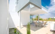 Modern Villas in Protaras Cyprus at minimalist residence with shaded outdoor dining area in Villa Phoebe rentals