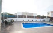 Private pool oasis with dining area, perfect for relaxation and enjoyment.