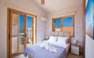 Bright and inviting double bedroom with balcony in Cyprus Villa Rentals in Protaras.