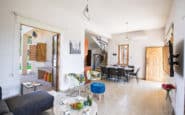 Modern open-plan living and dining area in a bright, airy Villa Rentals in Protaras.