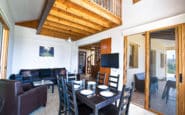 Modern rustic living and dining space with black furniture in Villa Rentals in Protaras.