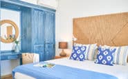 Seaside bedroom retreat in Protaras, Cyprus with blue and white decor for relaxation.