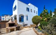 Charming Mediterranean-style white Cyprus Villa Rent with barbecue grill, garden, and blue shutters in Zonia-01.