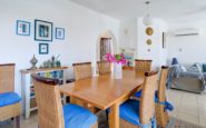 Cyprus Villa Rent with Bright and cozy dining and living area with contemporary decor and vibrant accents.