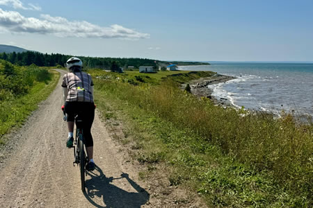 Cyclist enjoying peaceful coastal ride in Cyprus with ocean views.